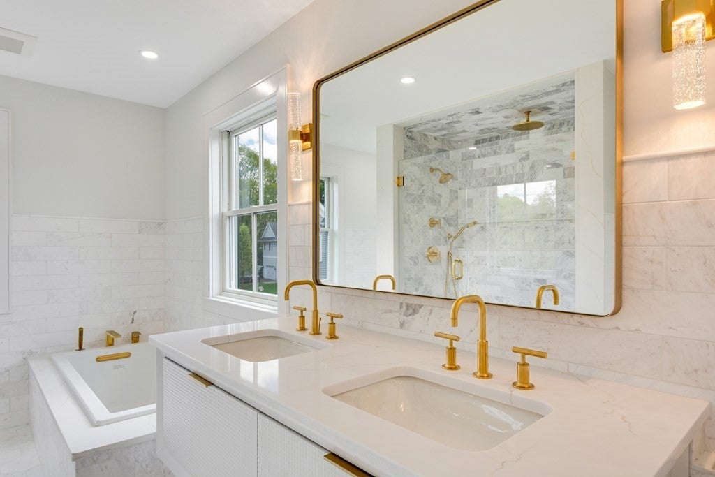 White bathroom, with gold finishes in Wellesley home.  modern farmhouse