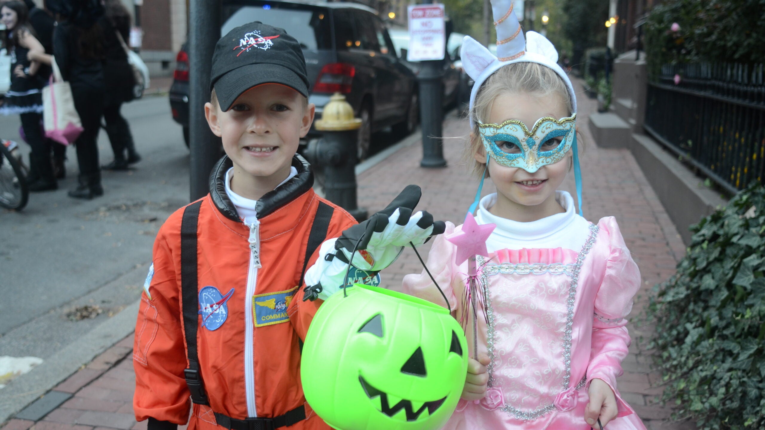 Beacon Hill residents Wakeman Gribbell, 5, (left) and his twin sister, Hadley, trick-or-treated as an astronaut and a unicorn princess, respectively.