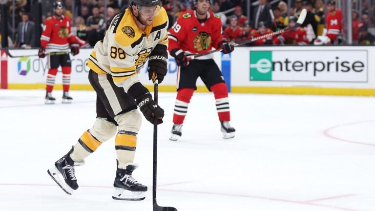 David Pastrnak of the Bruins scores a goal against the Chicago Blackhawks during the third period.