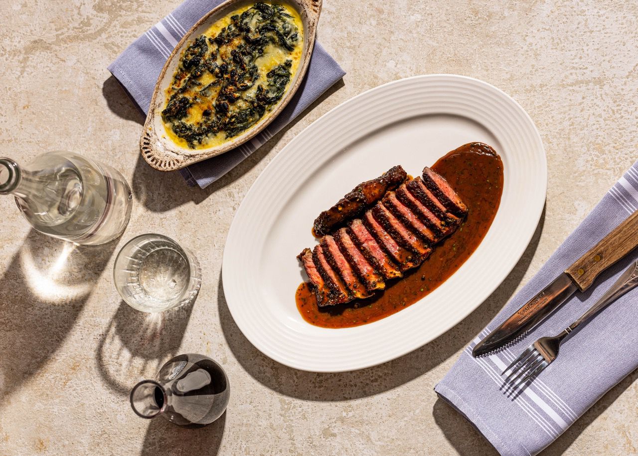 Charbroiled steak au poivre and creamed spinach with roasted garlic and white wine at DW French.