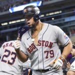 Houston Astros' Jose Abreu reacts after a two-run home run.