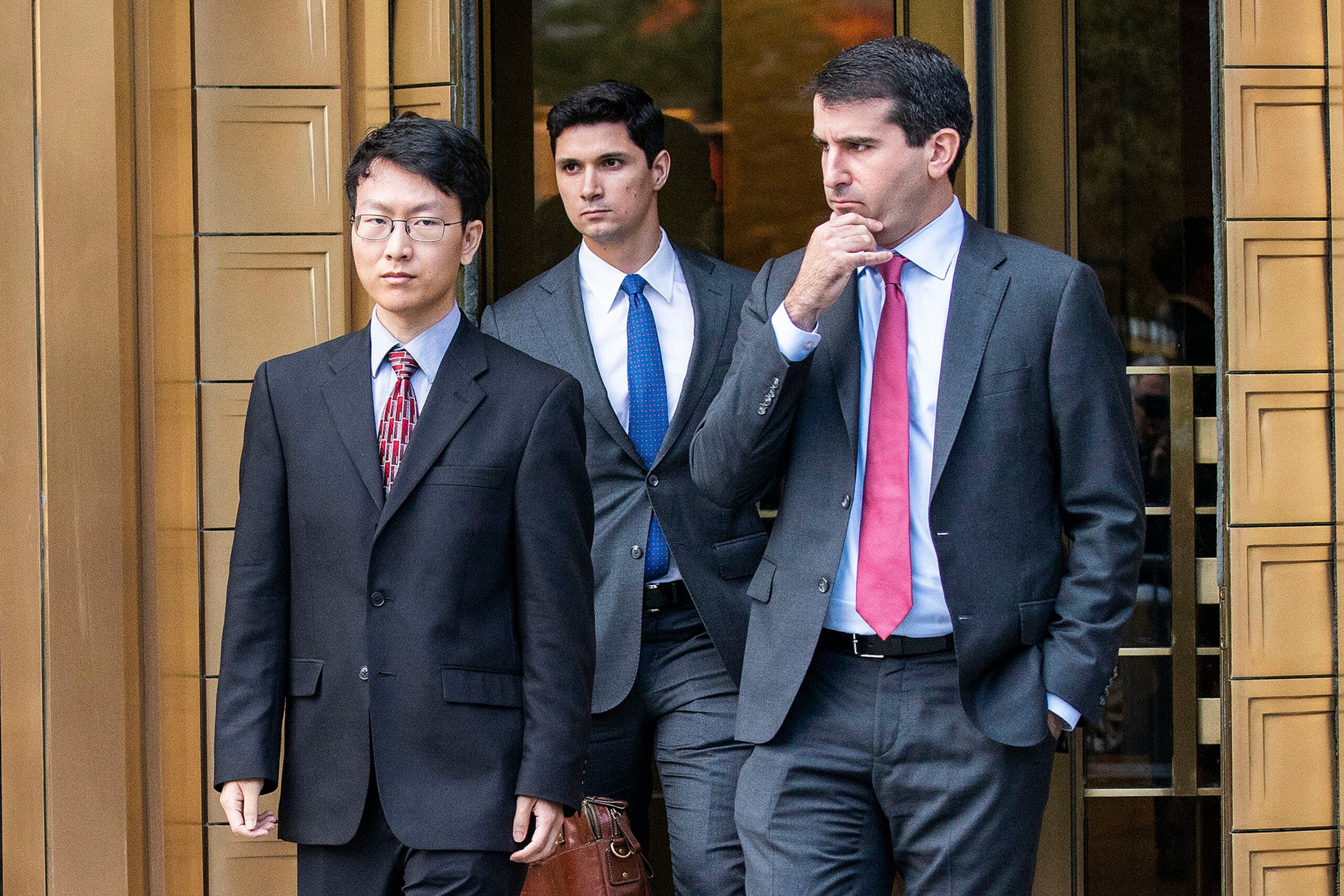 Gary Wang, left, co-founder and former chief technology officer of FTX Cryptocurrency Derivatives Exchange exits the Manhattan federal court.