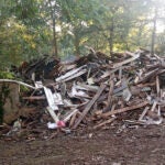 Susan Hodgson's mistakenly demolished family home sits in a pile of lumber and debris in southwest Atlanta, Georgia.