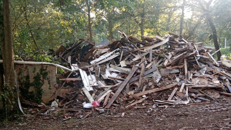 Susan Hodgson's mistakenly demolished family home sits in a pile of lumber and debris in southwest Atlanta, Georgia.