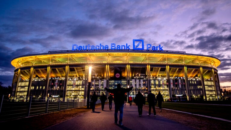 The Deutsche Bank Park is illuminated.