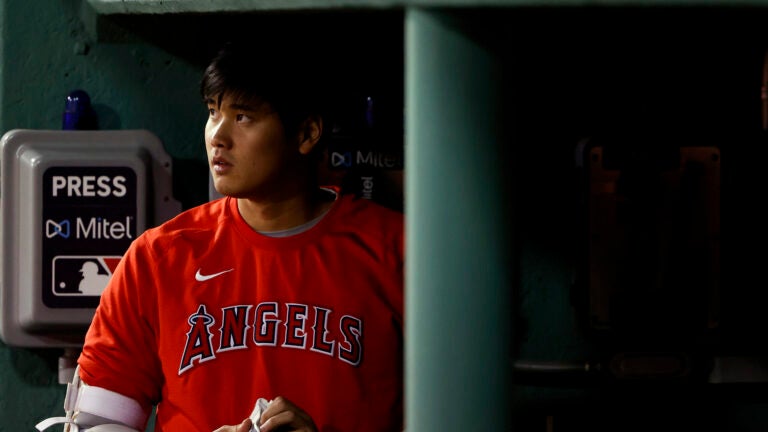 Los Angeles Angels' Shohei Ohtani in the dugout during the sixth inning of a baseball game against the Boston Red Sox Friday, May 14, 2021, at Fenway Park in Boston.