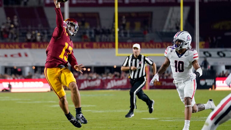 Southern California quarterback Caleb Williams (13) throws a touchdown pass to wide receiver Kyron Hudson.