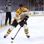 Matthew Poitras #51 of the Boston Bruins skates against the Detroit Red Wings during the third period at TD Garden on October 28, 2023 in Boston, Massachusetts. The Bruins defeat the Red Wings 4-1.