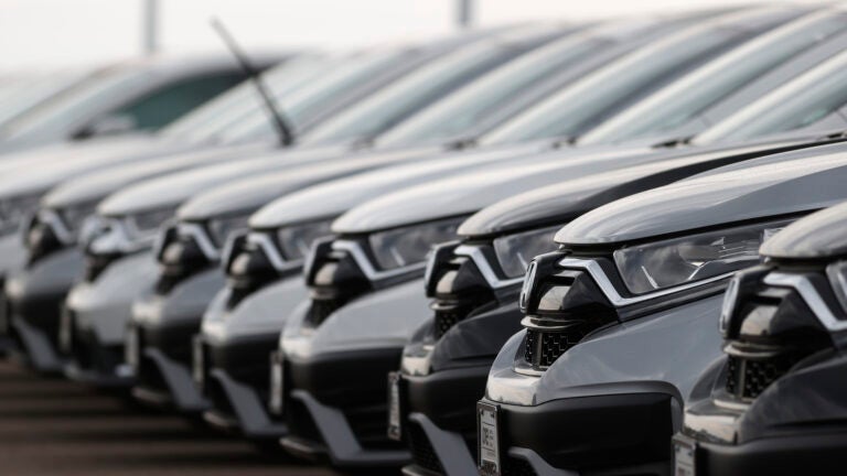 Car Doctor -- In this Sunday, June 28, 2020, photograph, a long line of unsold 2020 CR-V sports-utility vehicles sits at a Honda dealership in Highlands Ranch, Colo.