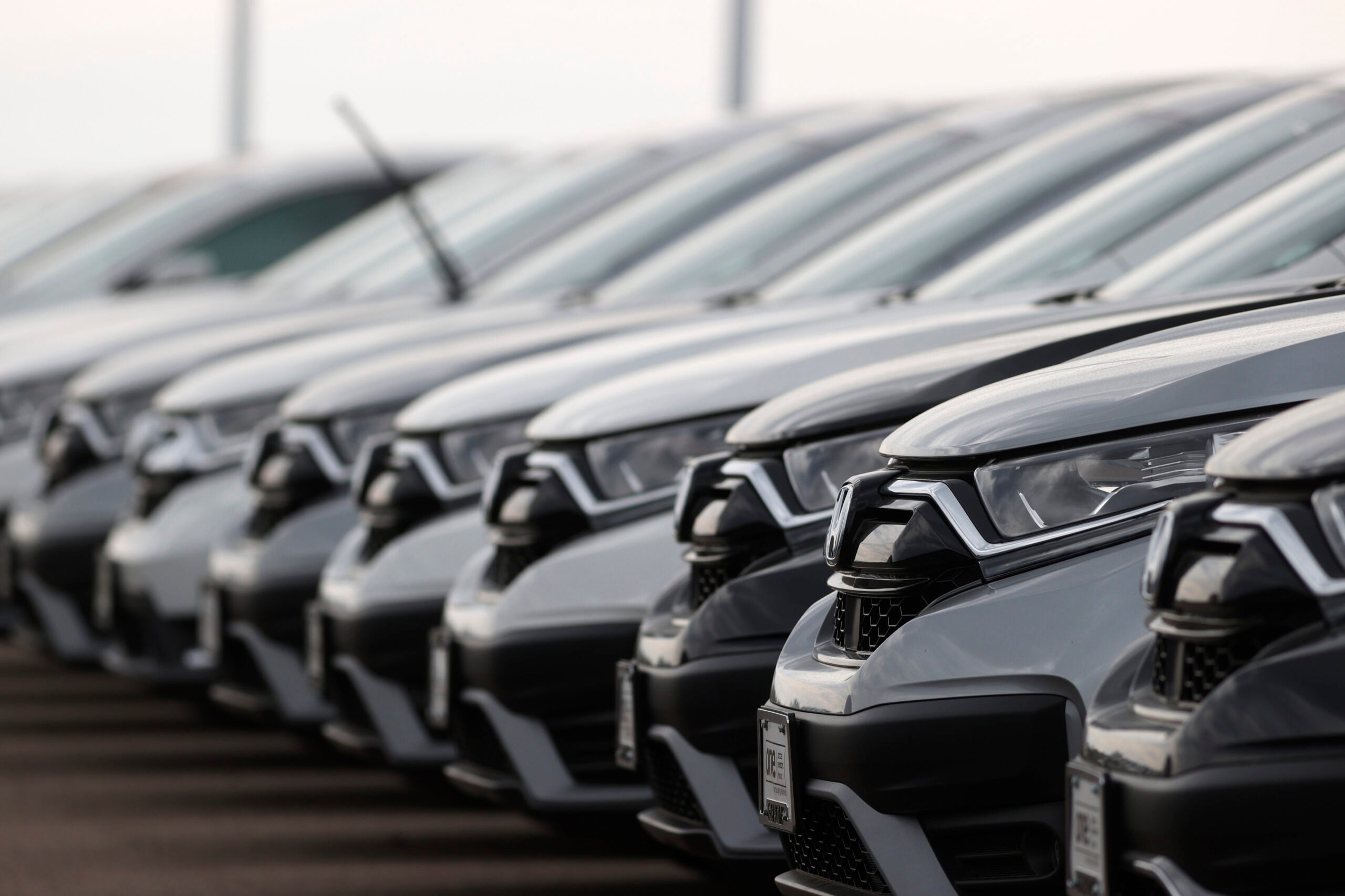 Car Doctor -- In this Sunday, June 28, 2020, photograph, a long line of unsold 2020 CR-V sports-utility vehicles sits at a Honda dealership in Highlands Ranch, Colo.