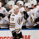 Boston Bruins' Charlie Coyle (13) is congratulated for his goal against the New York Rangers during the second period of an NHL preseason hockey game Thursday, Oct. 5, 2023, in New York.