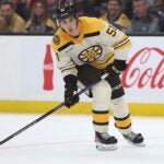 Matthew Poitras #51 of the Boston Bruins skates against the Chicago Blackhawks in his first NHL game during the third period of the Bruins home opener at TD Garden on October 11, 2023 in Boston, Massachusetts. The Bruins defeat the Blackhawks 3-1.