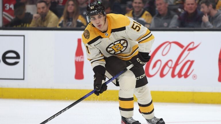 Matthew Poitras #51 of the Boston Bruins skates against the Chicago Blackhawks in his first NHL game during the third period of the Bruins home opener at TD Garden on October 11, 2023 in Boston, Massachusetts. The Bruins defeat the Blackhawks 3-1.