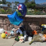A makeshift memorial for a 4-year-old who died after finding a gun in a car outside a cannabis dispensary in Manitou Springs, Colo.