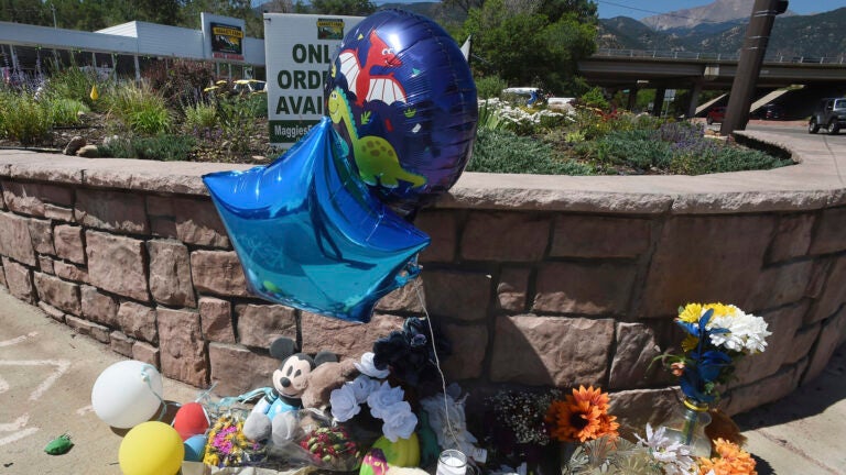 A makeshift memorial for a 4-year-old who died after finding a gun in a car outside a cannabis dispensary in Manitou Springs, Colo.