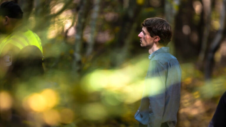 Logan Clegg walks along the Marsh Loop Trail.