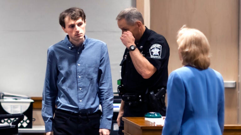 Logan Clegg enters the courtroom at Merrimack County Superior Court.