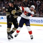 Charlie McAvoy #73 of the Boston Bruins commits an illegal check to the head against Oliver Ekman-Larsson #91 of the Florida Panthers during the third period at TD Garden on October 30, 2023 in Boston, Massachusetts.