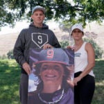 Padrig and Gina Fahey hold a photo of their son, Braden, 12.