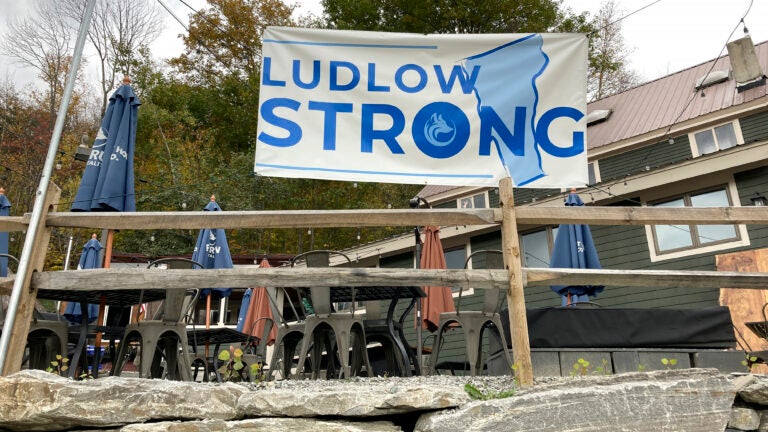 A "Ludlow Strong" sign hangs outside a restaurant, in Ludlow, Vt.