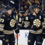 Boston Bruins' David Pastrnak (88) celebrates his goal agains the Philadelphia Flyers with Charlie McAvoy (73) and Pavel Zacha (18) during the first period of a preseason NHL hockey game Friday, Sept. 29, 2023, in Boston