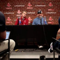 President of the Boston Red Sox Sam Kennedy (L) and Red Sox manager Alex Cora speak to reporters during the Red Sox season-ending press conference.