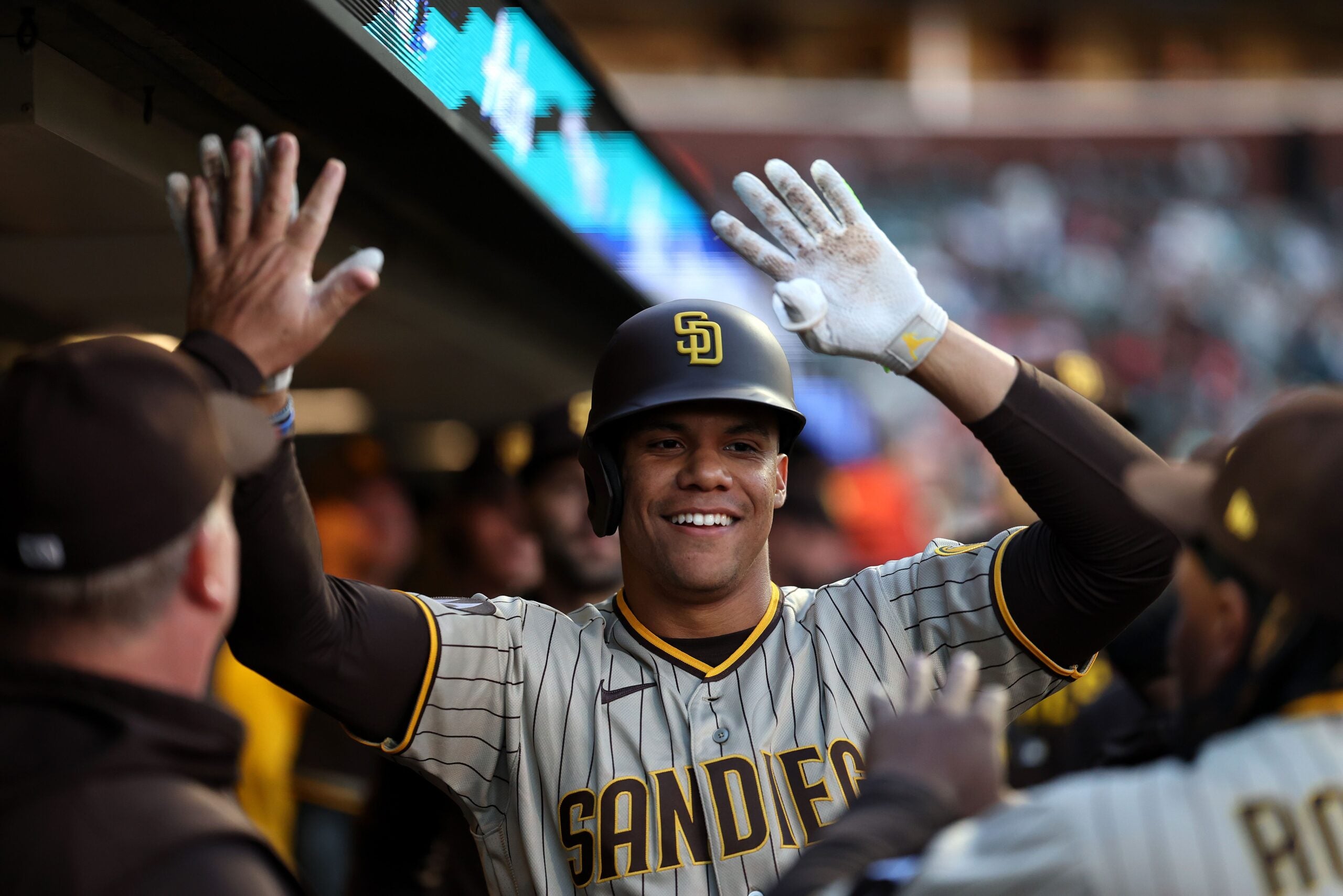 Juan Soto #22 of the San Diego Padres is congratulated by teammates after he hit a home run against the San Francisco Giants in the first inning at Oracle Park on September 26, 2023 in San Francisco, California.