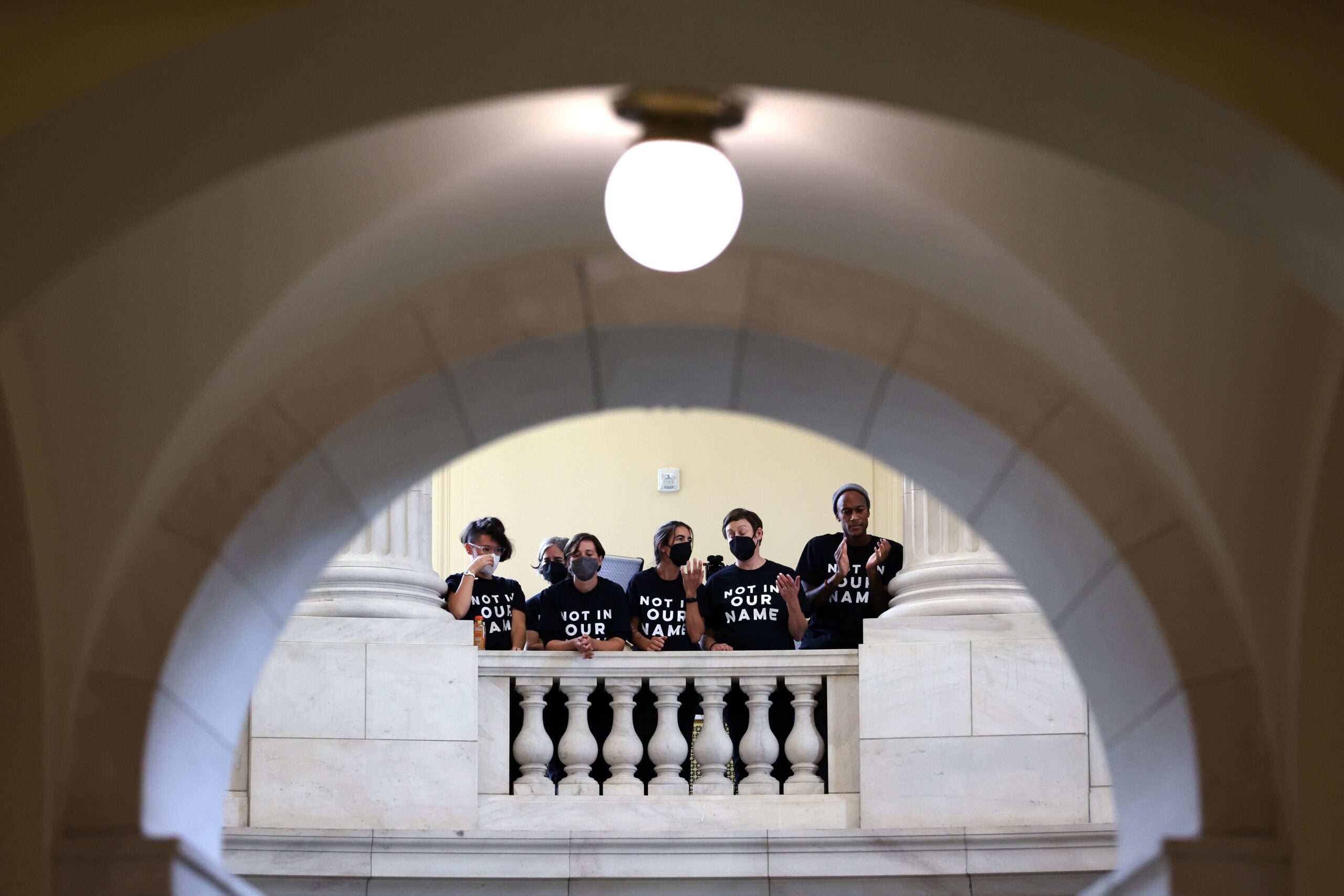 Protesters hold a demonstration in support of a cease fire against the Palestinians in Gaza in the Cannon House Office Building. 