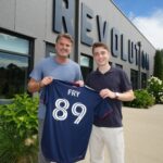 Revolution technical director Curt Onalfo with Malcolm Fry, an 18-year-old from Groton.