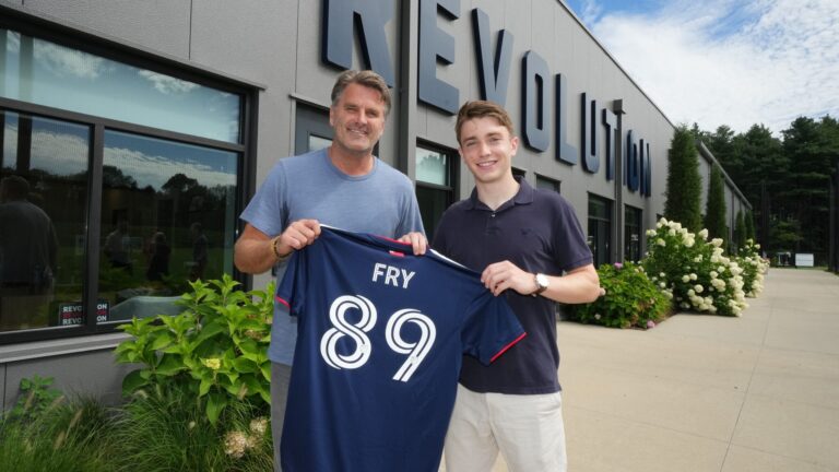 Revolution technical director Curt Onalfo with Malcolm Fry, an 18-year-old from Groton.