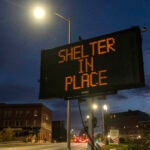 A sign reads "shelter in place."