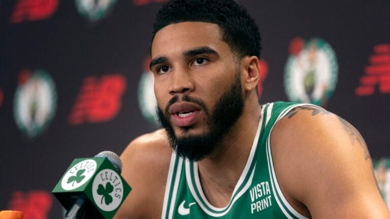 Boston Celtics' Jayson Tatum speaks at a news conference.