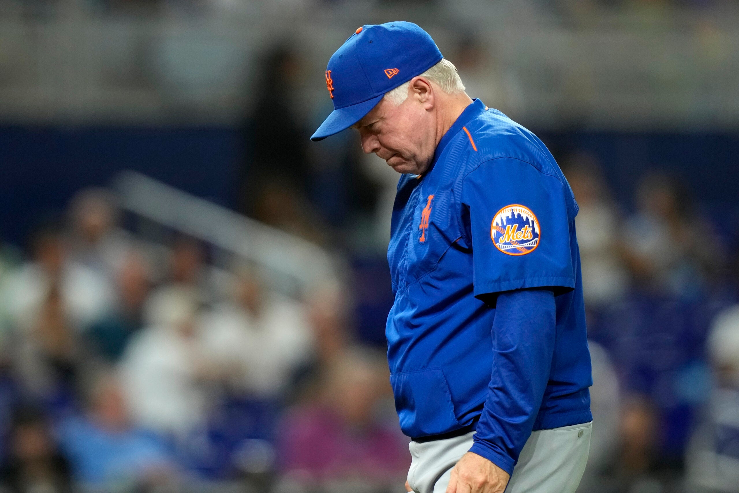 New York Mets manager Buck Showalter walks from the mound.
