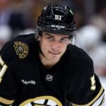 BOSTON, MASSACHUSETTS - OCTOBER 30: Matthew Poitras #51 of the Boston Bruins looks on during the second period against the Florida Panthers at TD Garden on October 30, 2023 in Boston, Massachusetts.