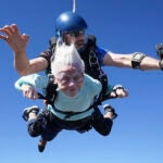 FILE - This photo shows Dorothy Hoffner, 104, falling through the air with tandem jumper Derek Baxter, Sunday, Oct. 1, 2023, at Skydive Chicago in Ottawa, Ill.
