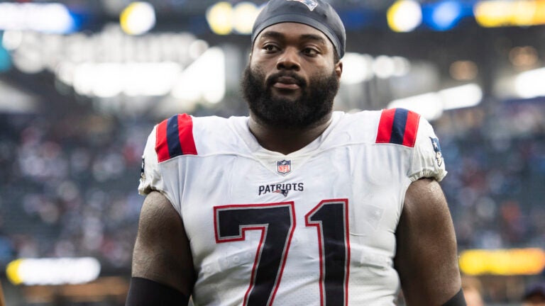 New England Patriots guard Mike Onwenu (71) walks back to the locker room after the team defeats the Los Angeles Chargers in an NFL football game Sunday, Oct. 31, 2021, in Inglewood, Calif.