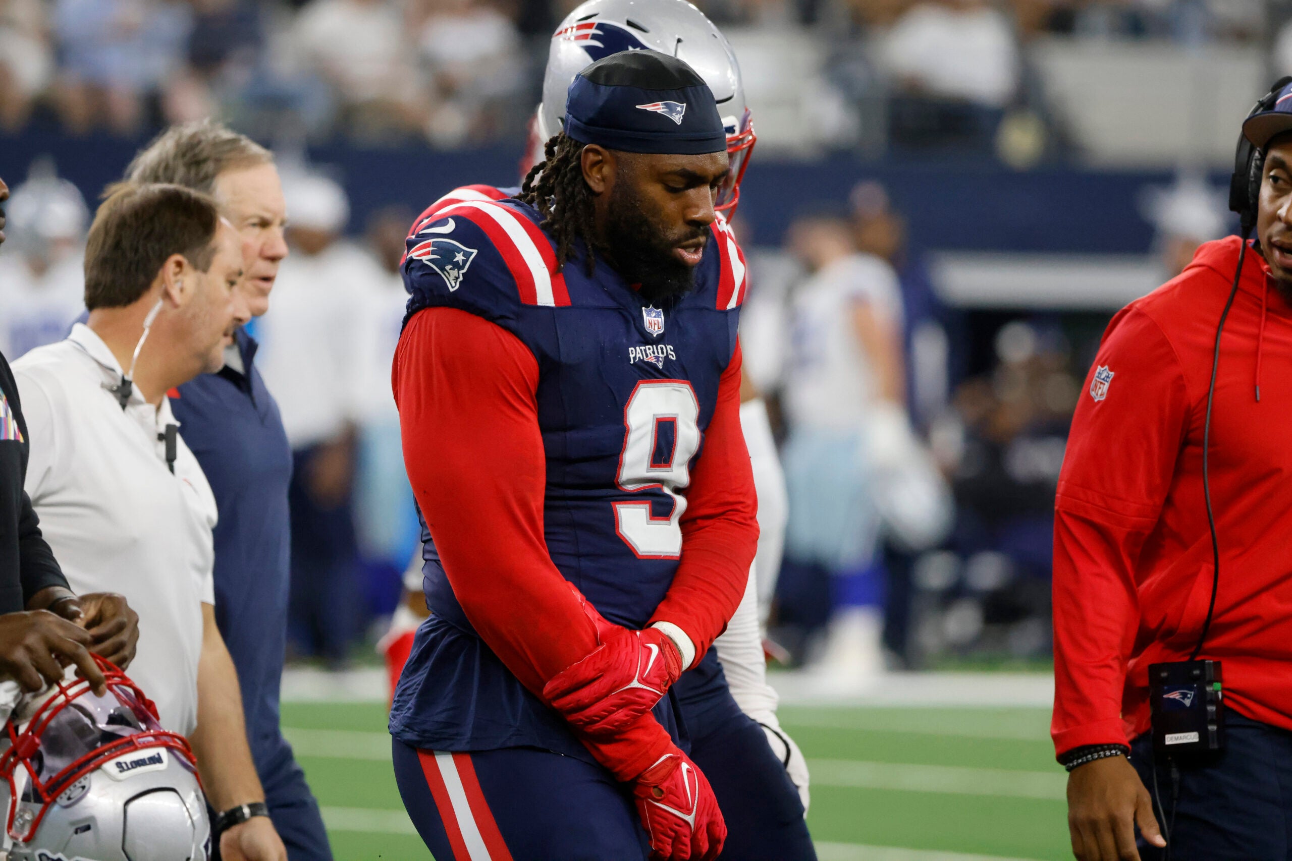 New England Patriots linebacker Matthew Judon (9) walks off the field after an injury against the Dallas Cowboys during an NFL Football game in Arlington, Texas, Sunday, Nov. 1, 2023.