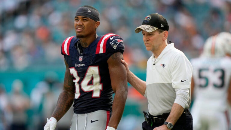 New England Patriots wide receiver Kendrick Bourne (84) is led off the field during the second half of an NFL football game against the Miami Dolphins, Sunday, Oct. 29, 2023, in Miami Gardens, Fla.