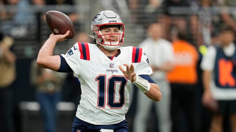 New England Patriots quarterback Mac Jones (10) throws against the Las Vegas Raiders during an NFL football game Sunday, Oct. 15, 2023, in Las Vegas.