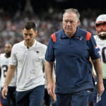 New England Patriots head coach Bill Belichick walks off the field at the end of the first half of an NFL football game against the Las Vegas Raiders, Sunday, Oct. 15, 2023, in Las Vegas.