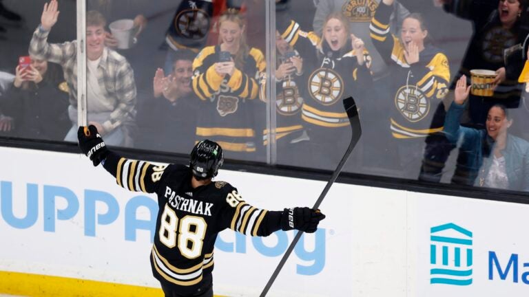 Boston Bruins' David Pastrnak celebrates his goal on a penalty shot during the second period of an NHL hockey game against the Nashville Predators, Saturday, Oct. 14, 2023, in Boston.