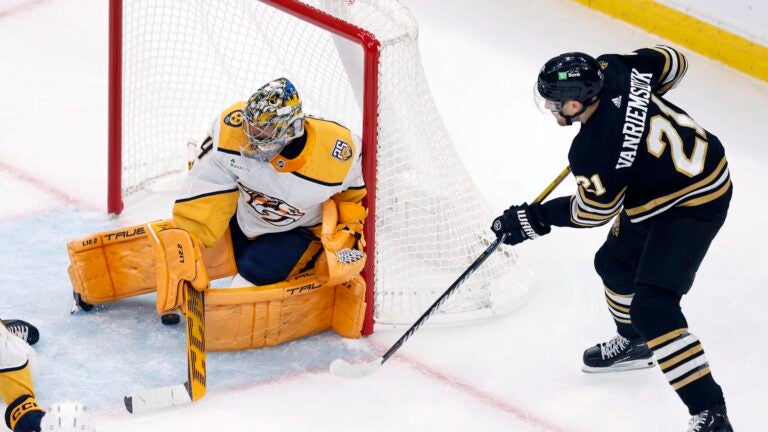 Boston Bruins' James van Riemsdyk (21) scores on Nashville Predators' Juuse Saros during the first period of an NHL hockey game, Saturday, Oct. 14, 2023, in Boston.