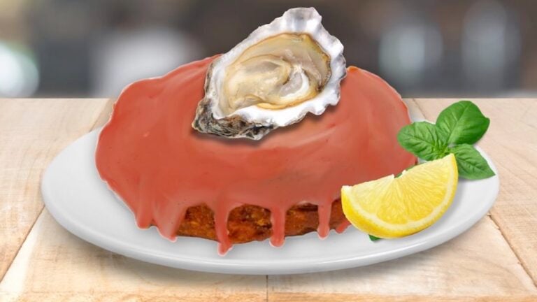 A photoshopped image of a red doughnut, with an oyster in its half shell sitting on top of it. A lemon and garnish is also on the plate with the doughnut.
