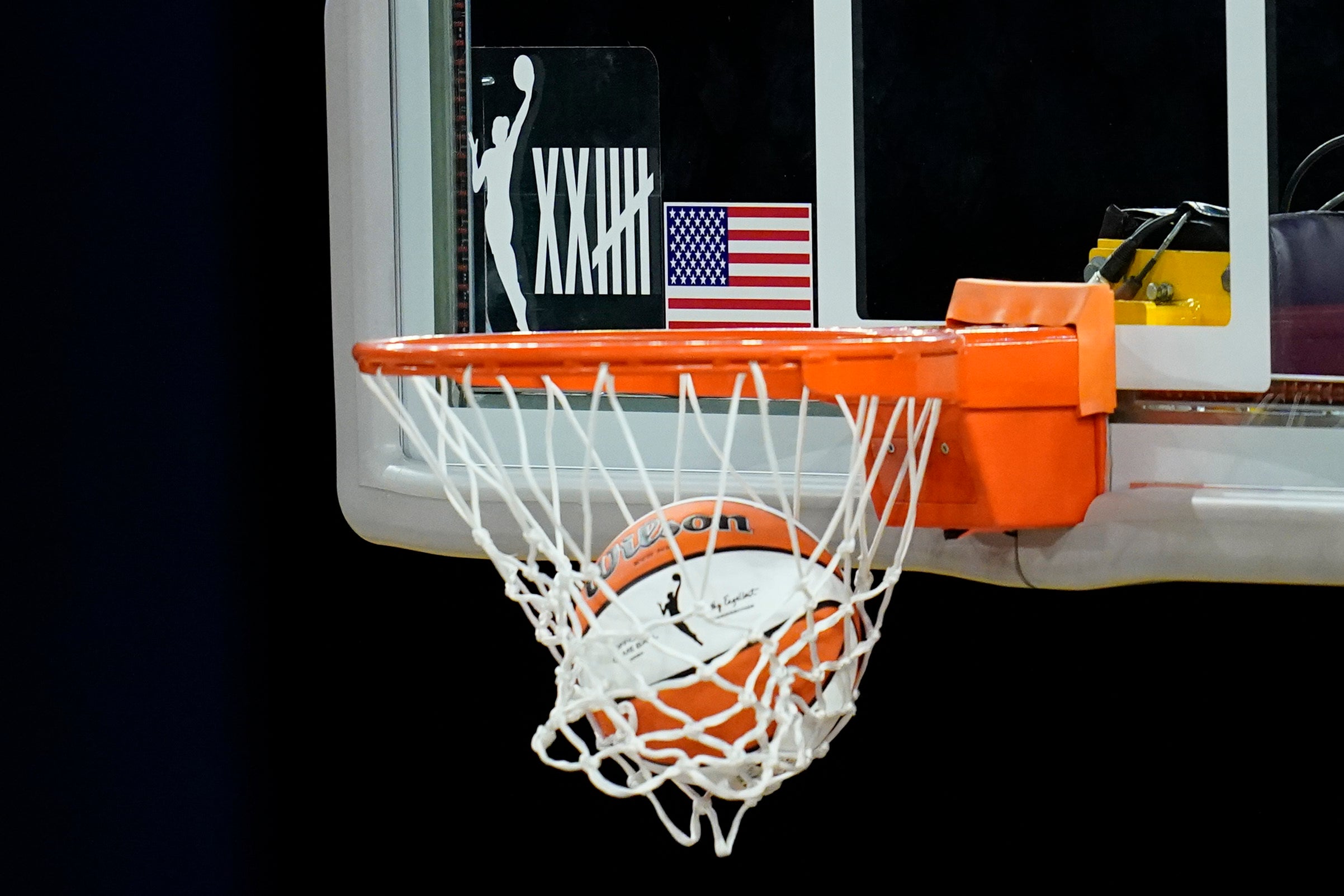 A logo on the backboard marks the 25th anniversary of the WNBA.
