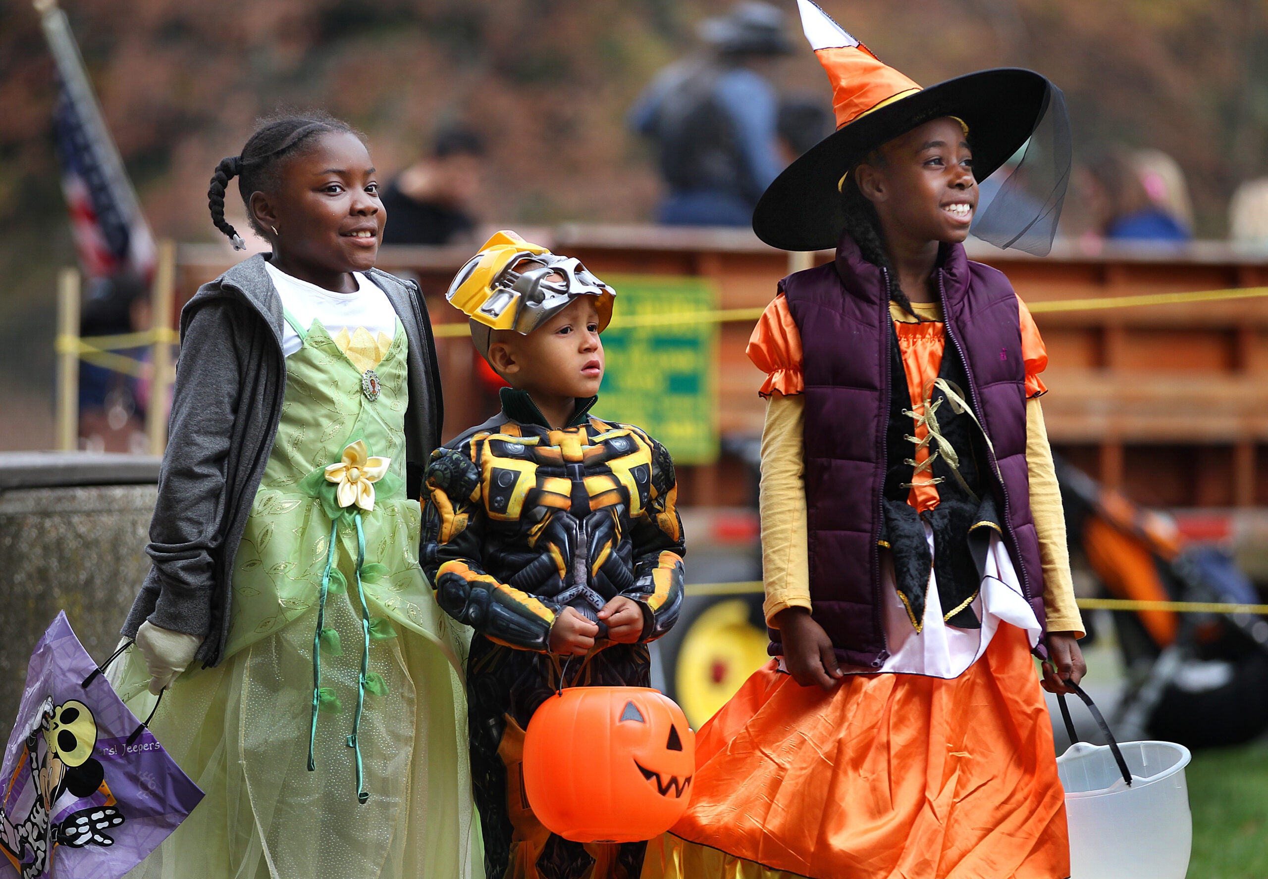Waiting in line for a hay ride, (left to right) Jkhia Bullock, 7, Tahje McBride, 4, and Allisa Johnson. 7 all from Dorchester are dressed for the occasion on Oct. 10, 2012.