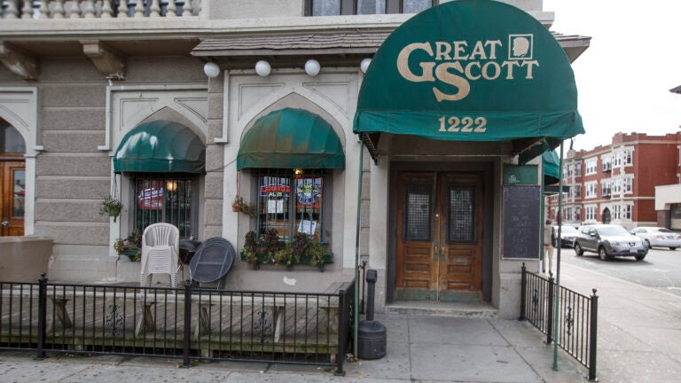 A picture of a building with a green awning that says "Great Scott," a closed music venue in Boston.