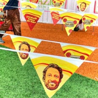The visage of Barstool Sports founder Dave Portnoy on banners at his One Bite Pizza Festival, at Coney Island in New York.