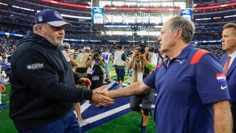 New England Patriots head coach Bill Belichick shaking hands with Dallas Cowboys head coach Mike McCarthy.