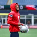 The Patriots held practice at Gillette Stadium. QB Cam Newton runs on to the field to cheers from fans.