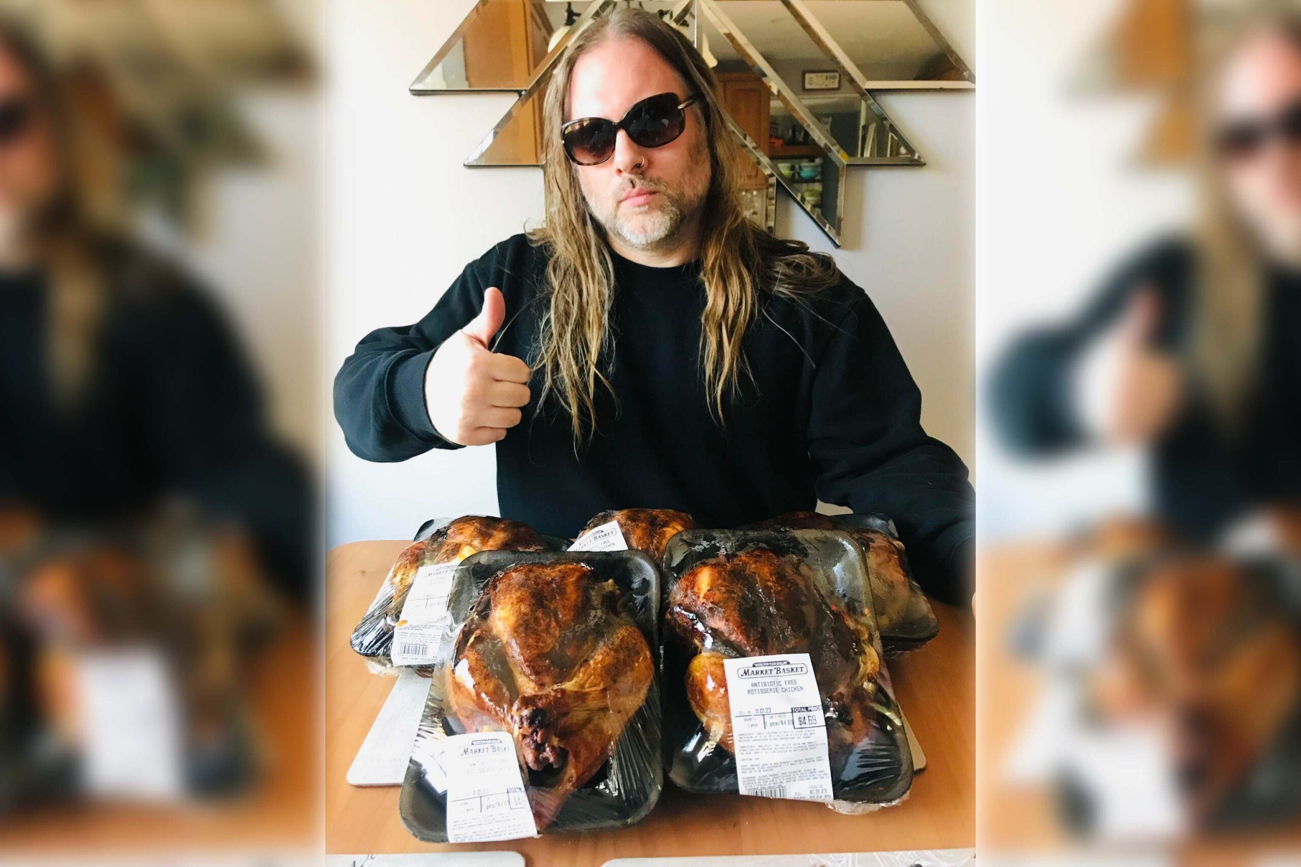 Michael O’Connor Marotta displays a thumbs up with his Market Basket rotisserie chickens.